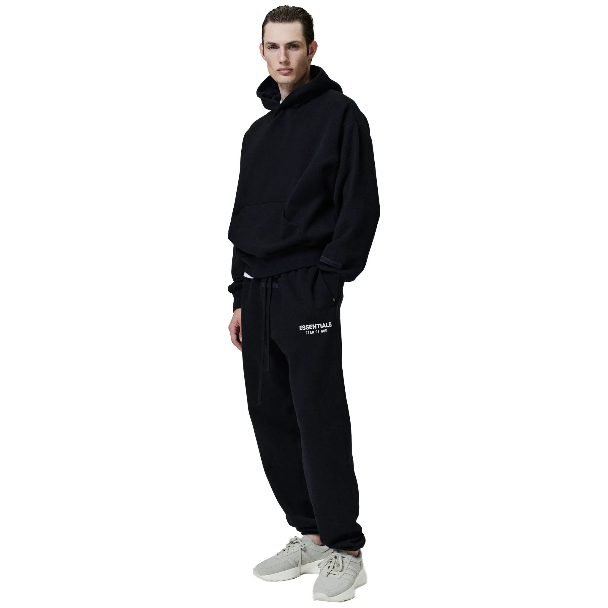 Model Front Side View of Fear Of God Essentials Classic Jet Black Sweatpants 130AS252020